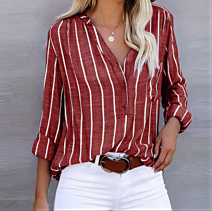 Back view of a women's relaxed fit striped shirt, ideal for comfortable everyday style or weekend wear. Classic long-sleeve blouse.