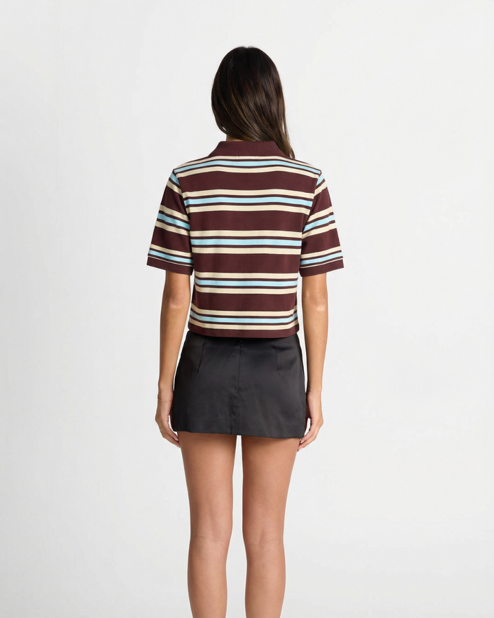 Chic striped women's polo shirt, short sleeve & relaxed fit, a versatile top for casual fashion and comfort.