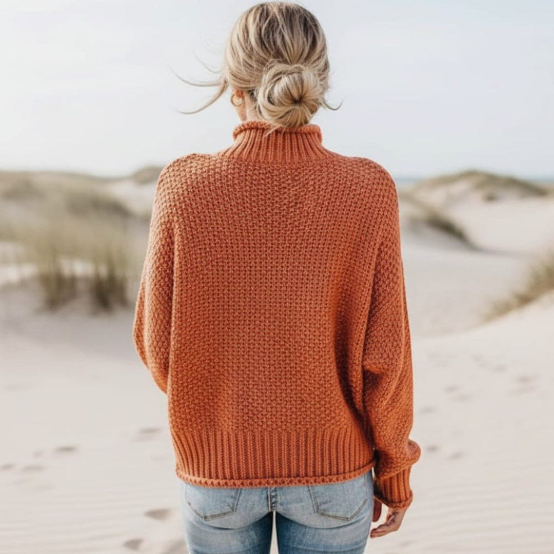 Oversized cozy turtleneck sweater for women. Relaxed fit pullover, ideal for winter fashion.