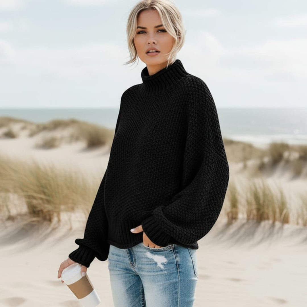 Warm women's relaxed fit turtleneck sweater. Cozy pullover, essential for winter fashion.