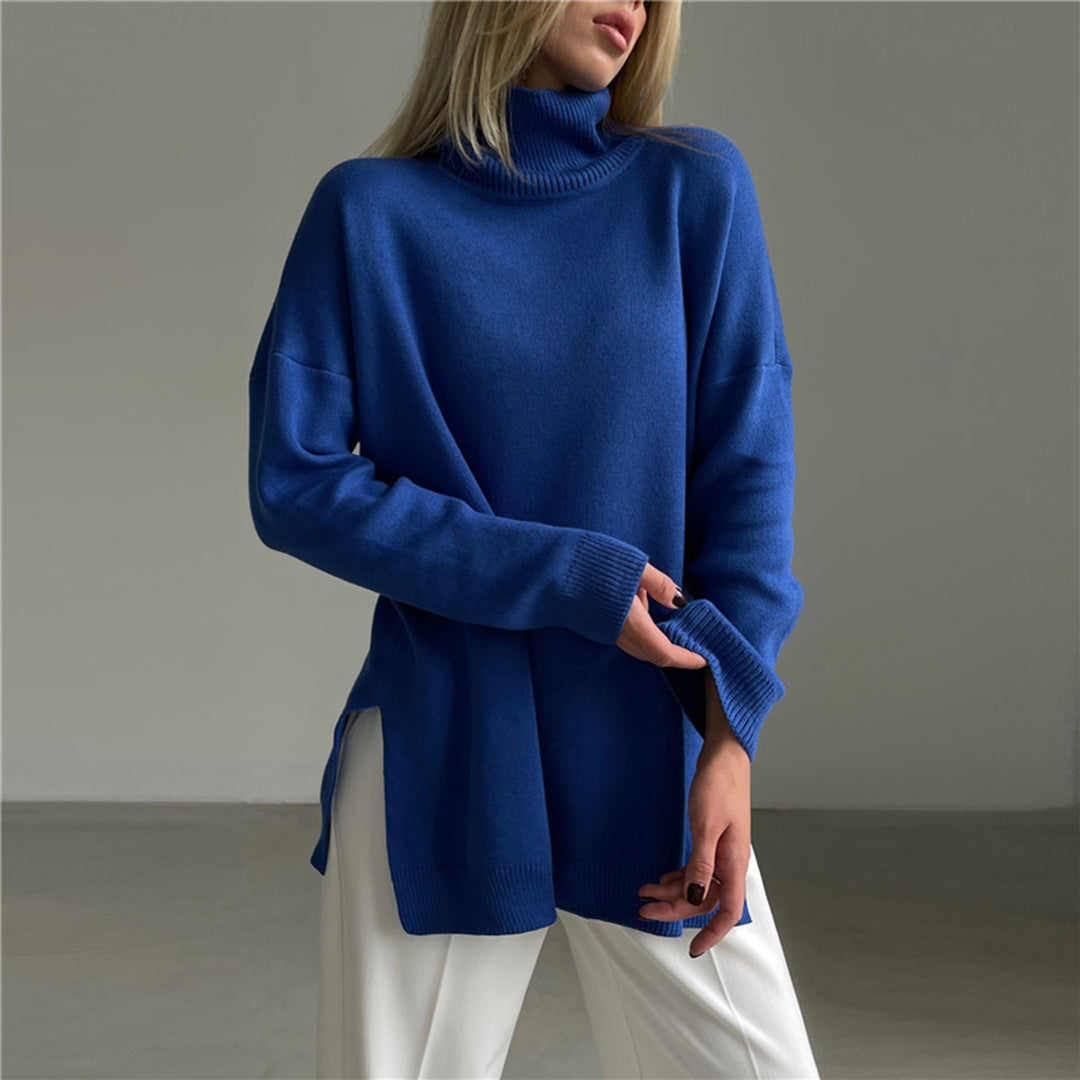 Women's long sleeve relaxed fit turtleneck sweater. Side split design makes this pullover a modern versatile top.