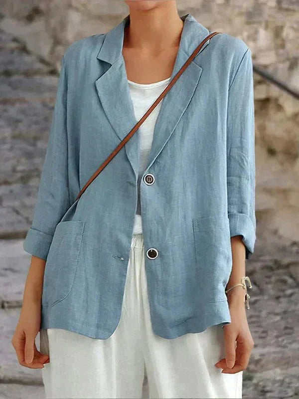 Women's relaxed 3/4 sleeve two-button blazer. Essential outerwear for casual chic & office fashion.