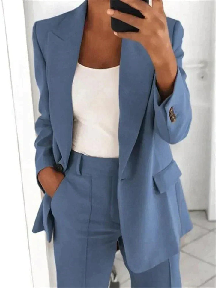 Women's relaxed fit two-piece suit set, featuring a stylish blazer & trousers, perfect for office or business casual.
