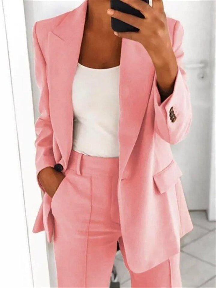 Effortless women's relaxed fit suit set, including a stylish blazer and comfortable trousers for professional attire.