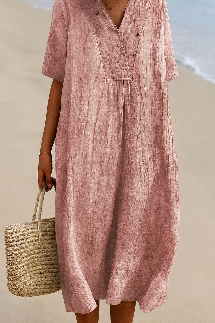 Women's flowy V-neck beach sundress with short sleeves, excellent for resort holidays & casual summer days.