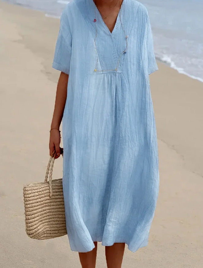Relaxed fit V-neck short sleeve summer dress for women, great for casual wear & beach vacations.