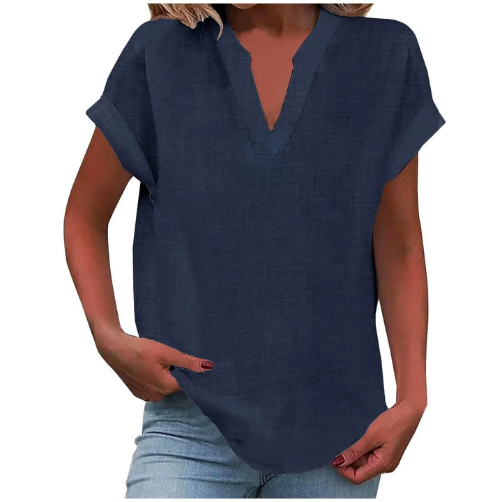 Flattering V-neck blouse for women, relaxed fit, with stylish cuffed short sleeves for summer style.