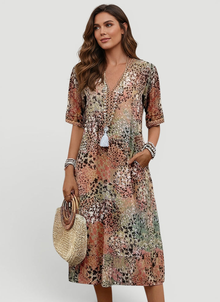 Women's relaxed fit V-neck midi dress, perfect for summer casual wear. Lightweight & flowy for everyday elegance.