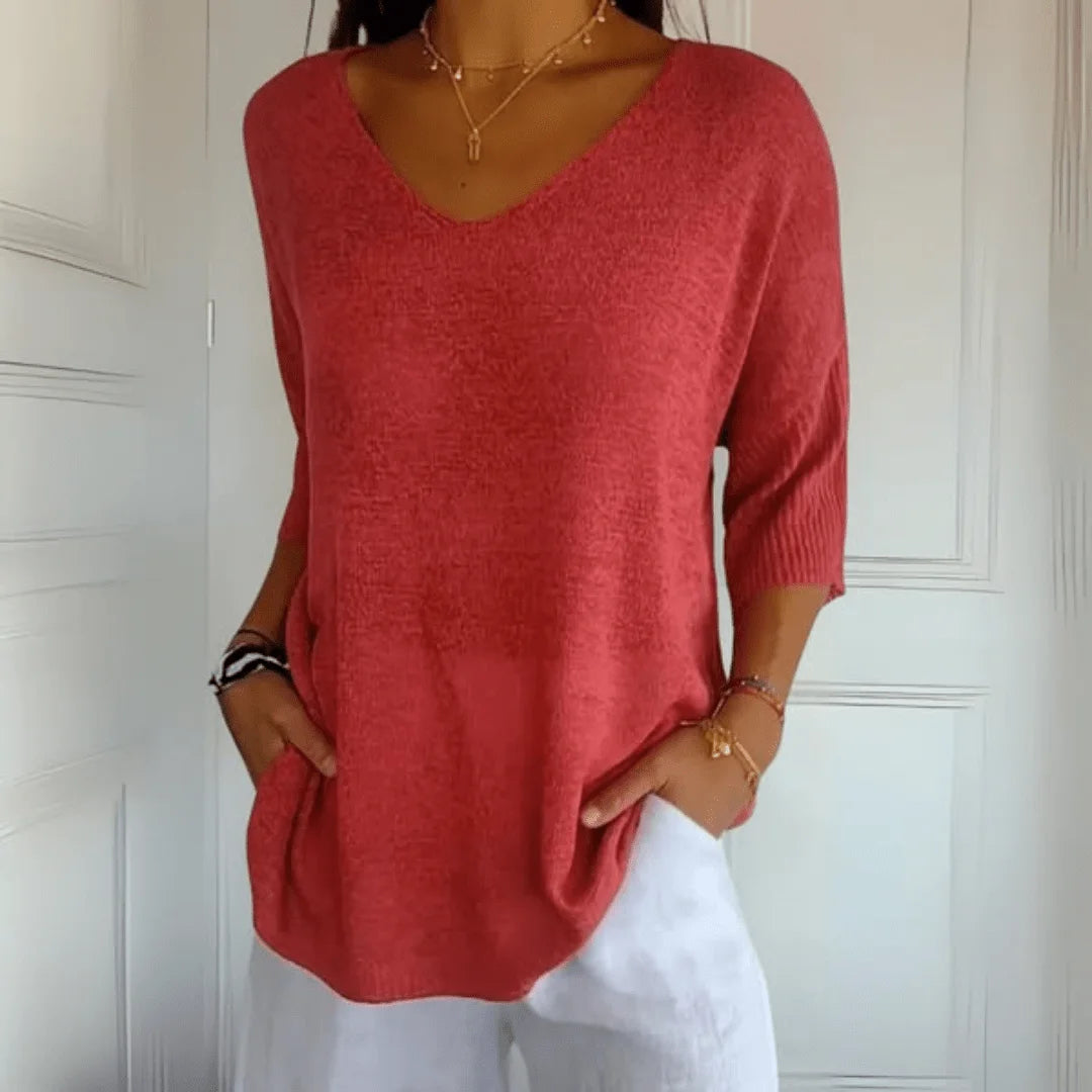 Women's relaxed fit V-neck top with 3/4 sleeves, perfect for casual everyday wear in spring or summer.
