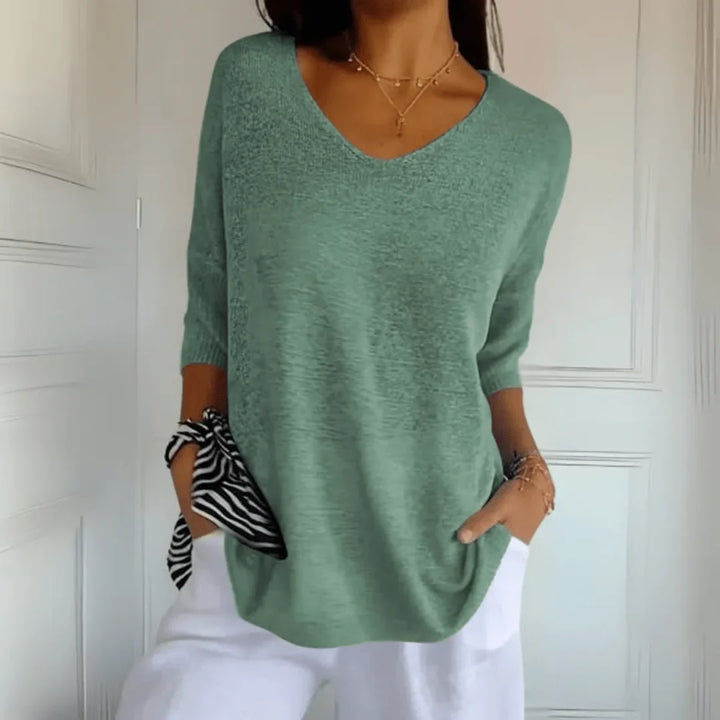 Casual women's V-neck top with 3/4 sleeves and a comfortable relaxed fit, great for daily outfits.