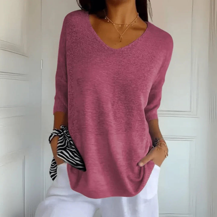 Comfortable relaxed fit V-neck top for women with elegant 3/4 sleeves, perfect for everyday casual style.