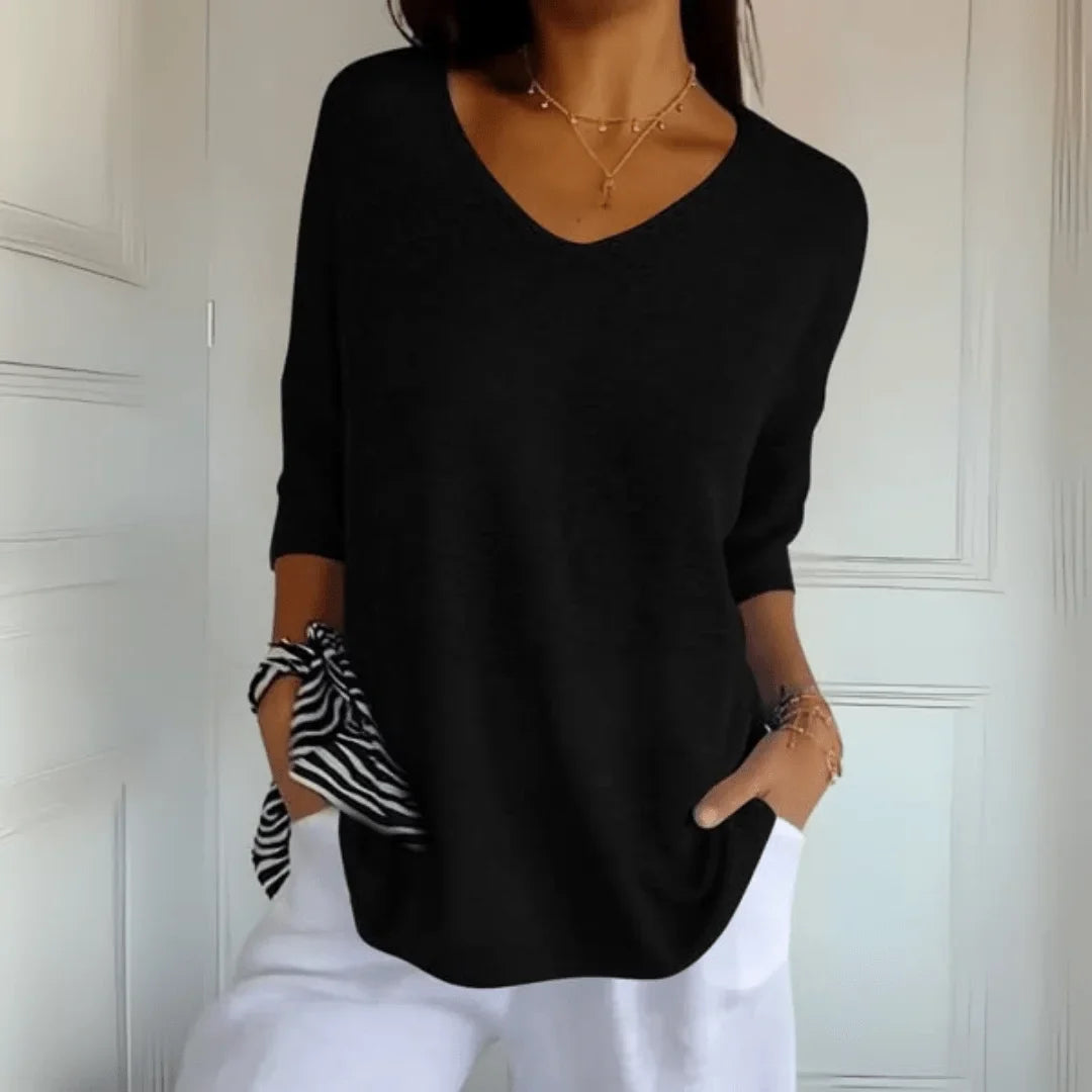 Versatile women's 3/4-sleeve V-neck top in a relaxed fit, suitable for casual or dressier fall outfits.