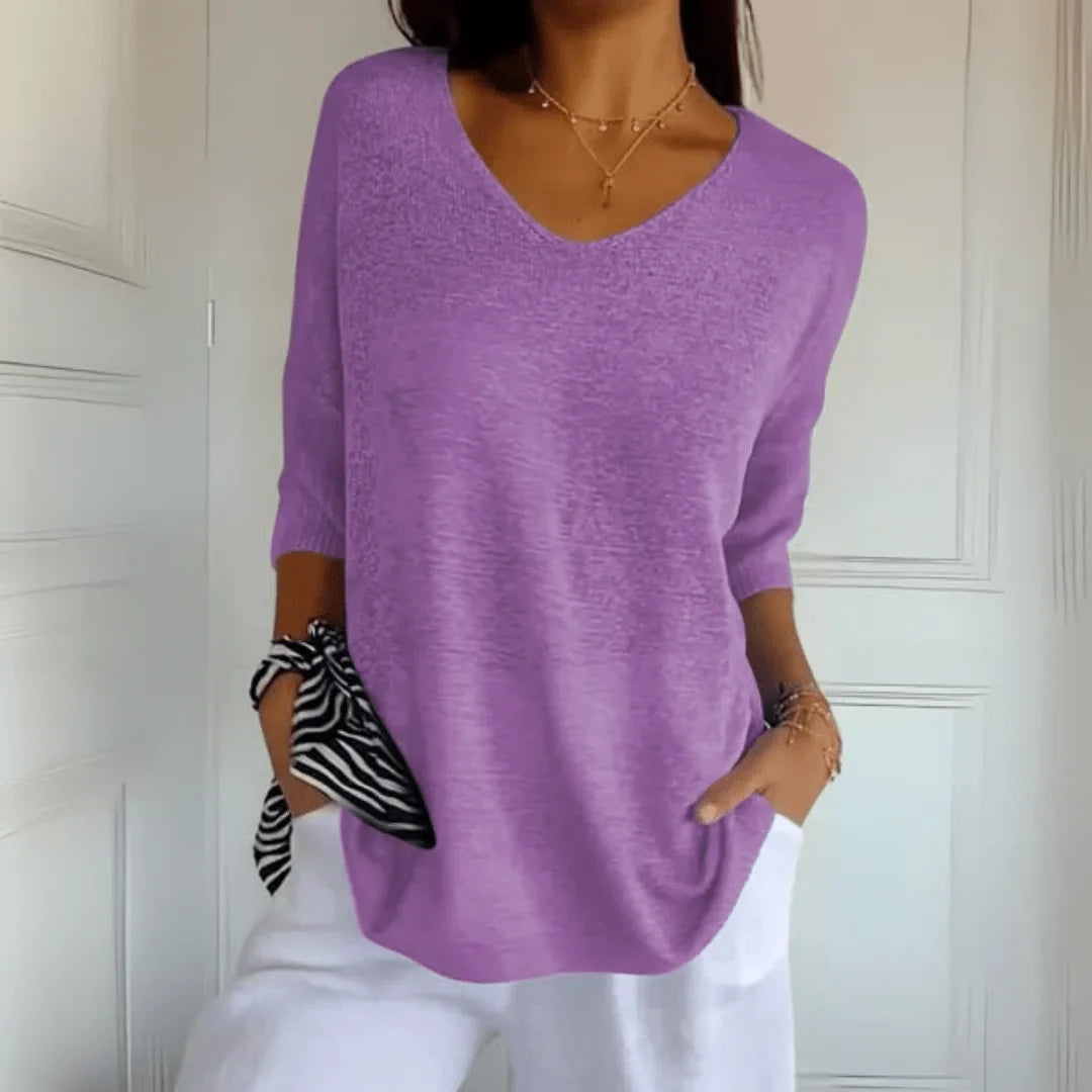 Everyday women's relaxed fit V-neck top with 3/4 sleeves, offering comfort and style for any season.