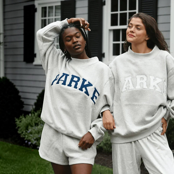 Cozy women's varsity sweater, oversized for ultimate everyday comfort & style.