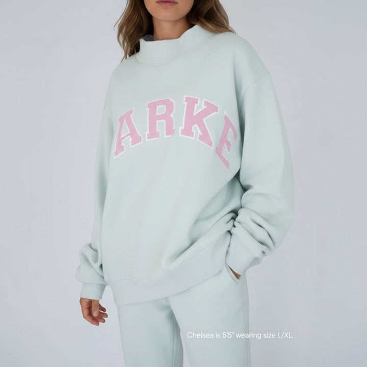 Long sleeve women's varsity sweater, perfect relaxed fit comfort for daily style.