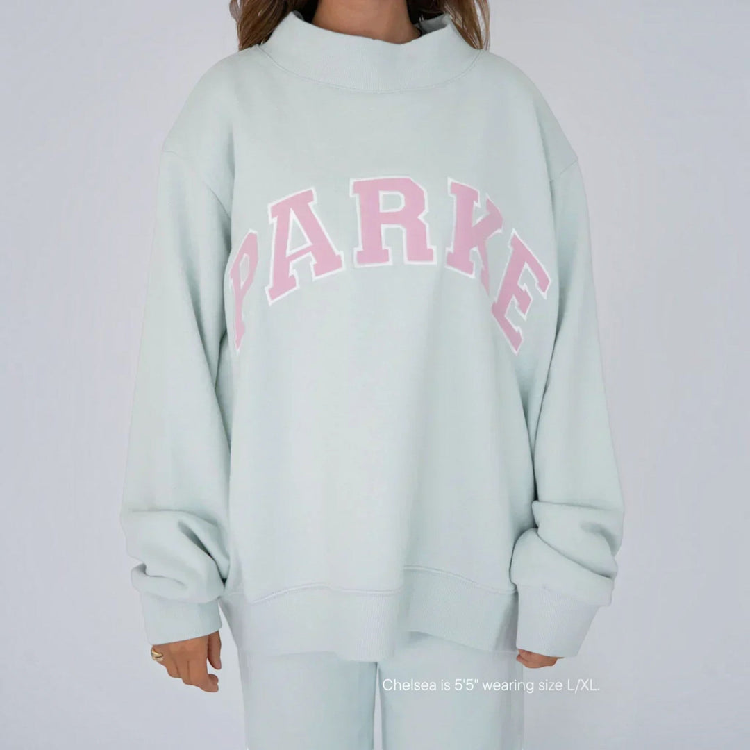 Cozy oversized women's collegiate pullover sweater in relaxed fit for daily fashion.
