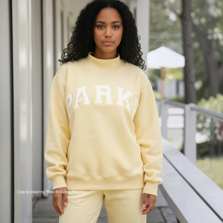 Relaxed fit women's sweater, varsity style for casual fashion & everyday comfort.