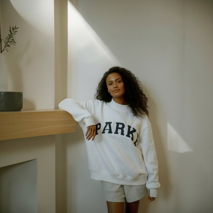 Cozy long sleeve women's hoodie, everyday comfort with a varsity design.