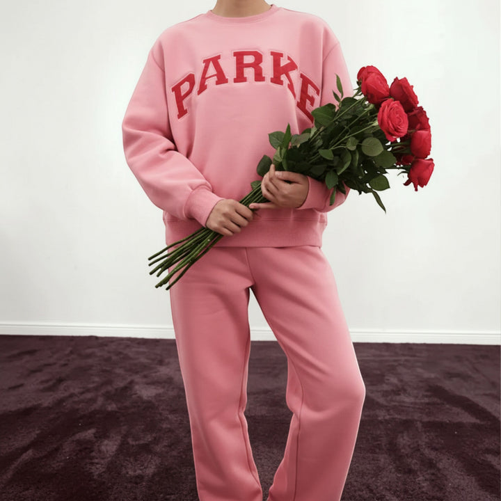 Relaxed fit women's pullover, collegiate varsity style for comfort & fashion.