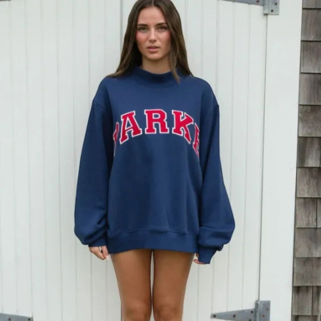 Varsity style long sleeve women's sweater, comfortable relaxed fit for daily wear.