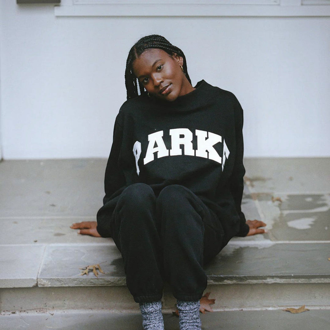 Pullover relaxed fit women's sweater, collegiate varsity design for casual fashion.