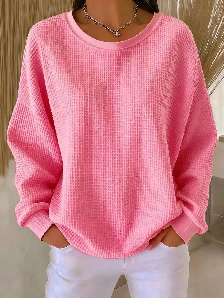 Textured long sleeve women's sweater. Relaxed fit, waffle knit, versatile for casual everyday wear.