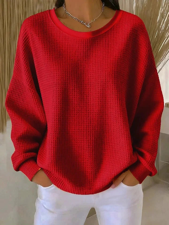Stylish women's long sleeve waffle knit sweater, relaxed fit for versatile casual wear.