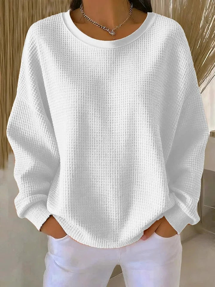 Comfortable women's long sleeve sweater with a unique waffle knit texture and relaxed fit.