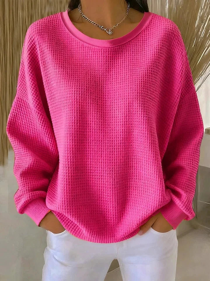 Women's cozy relaxed fit sweater with a stylish waffle knit design and comfortable long sleeves.