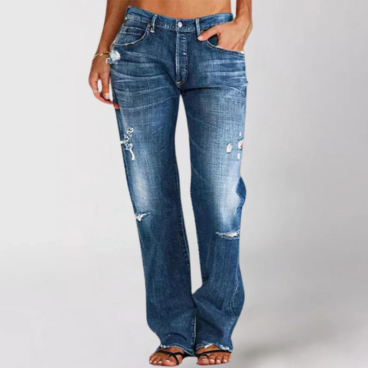 Stylish woman wearing blue wide-leg relaxed fit denim jeans, showcasing a comfortable, modern everyday fashion look.