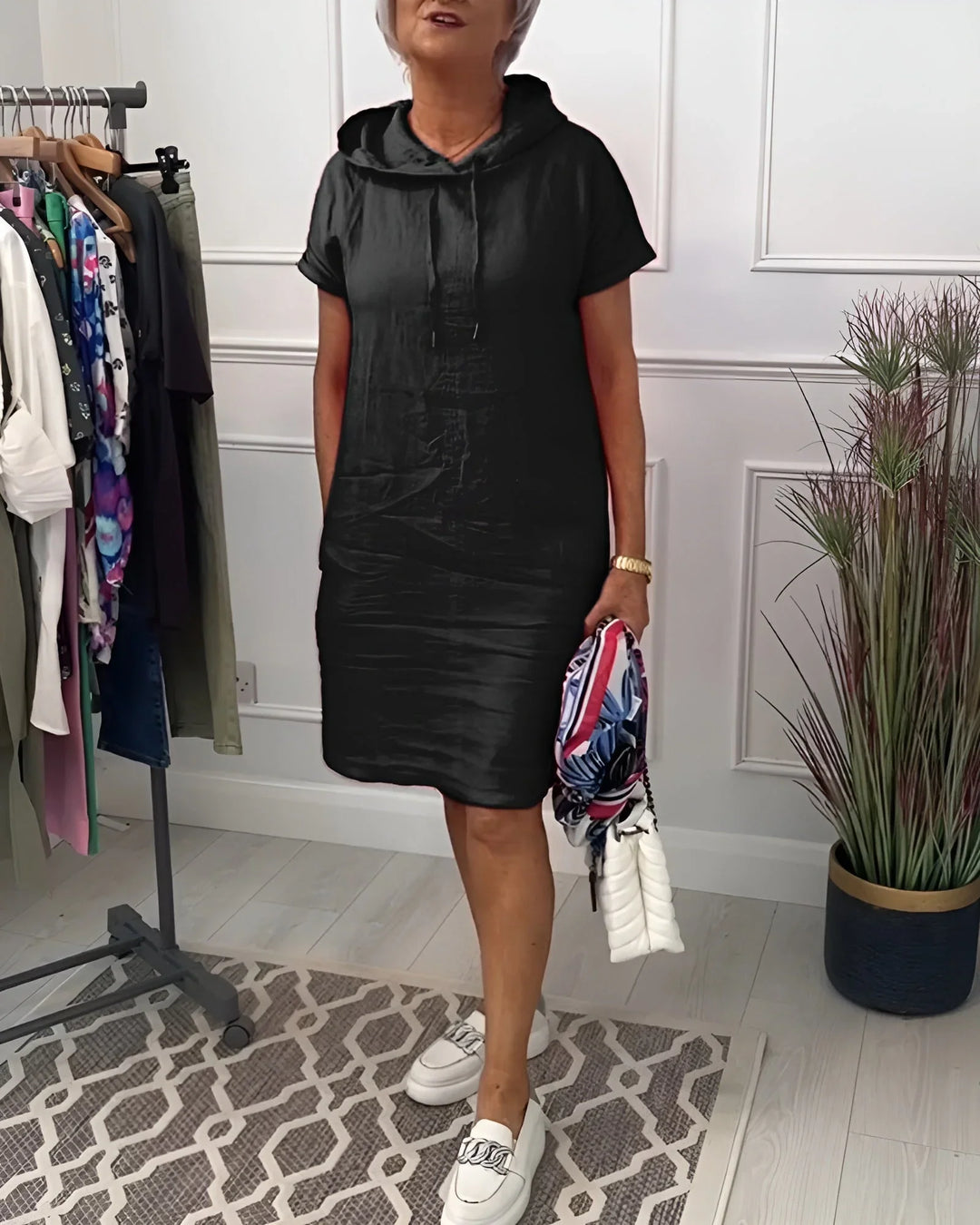 Comfortable women's hoodie dress, mini length, short sleeves, and handy side pockets for daily wear.