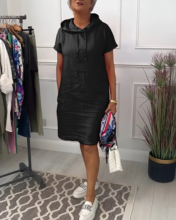 Comfortable women's hoodie dress, mini length, short sleeves, and handy side pockets for daily wear.