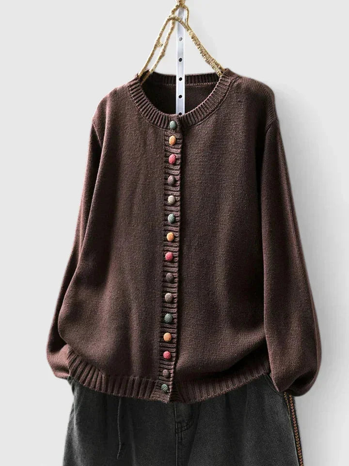 Chic women's knit cardigan sweater with eye-catching multi-color buttons. Versatile for casual or dressy looks.