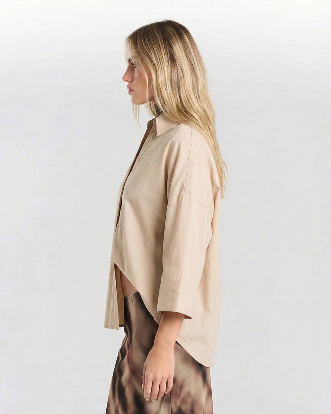 Casual women's button-up top with a loose, relaxed fit, a modern versatile everyday blouse.