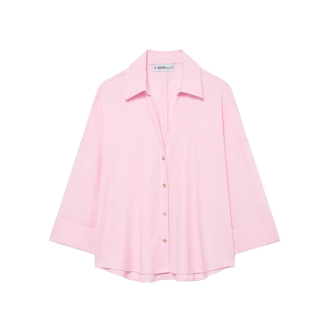 Oversized button-down shirt for women, a comfortable and chic blouse with a relaxed modern style.