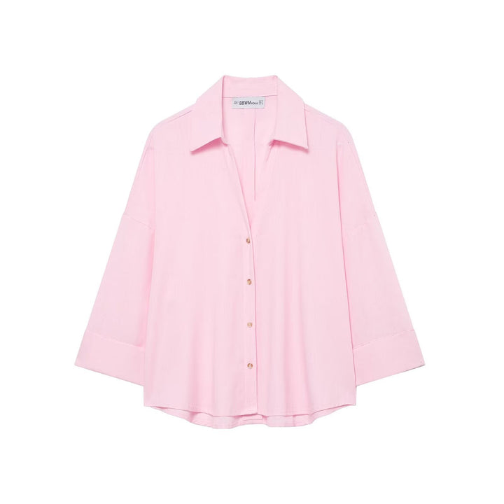 Oversized button-down shirt for women, a comfortable and chic blouse with a relaxed modern style.