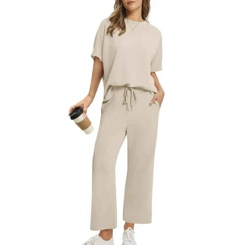 Women's relaxed ribbed two-piece top & trouser loungewear set for comfortable and versatile everyday wear.