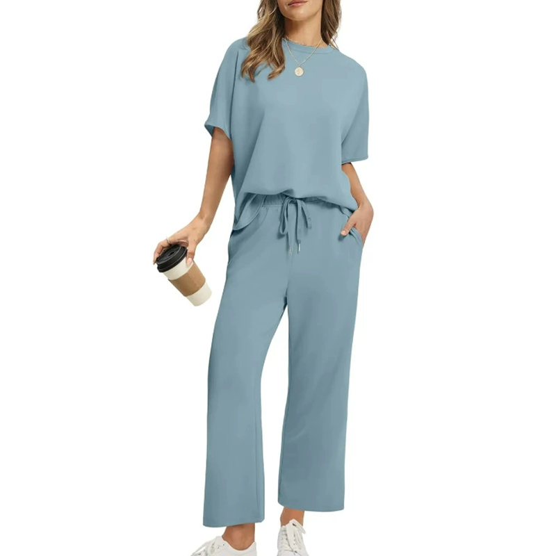 Comfortable women's ribbed knit top and wide-leg trousers set. Relaxed fit, perfect for lounging or casual outings.