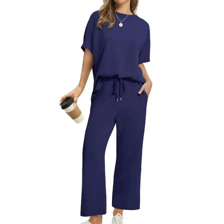 Women's comfortable ribbed knit top and trouser set. Relaxed two-piece loungewear outfit for versatile style.