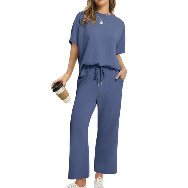 Soft women's ribbed long-sleeve top and matching high-waisted trousers set for ultimate comfort and style.