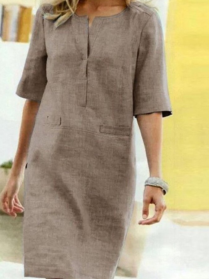 Elegant women's loose-fit shift dress, perfect for spring/summer casual or dressed-up wear.