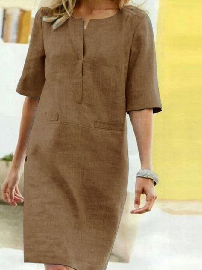 Lightweight women's shift dress, ideal for summer. Features a relaxed fit and simple, elegant design.