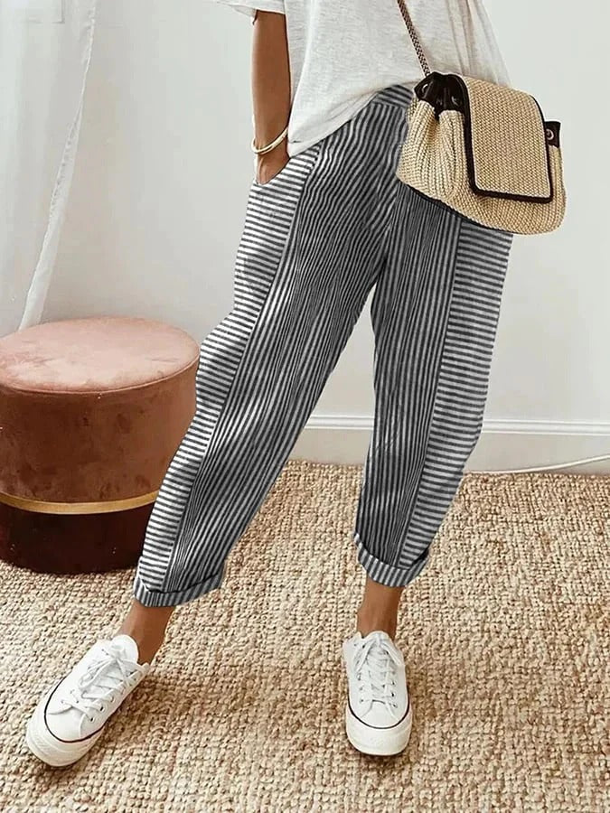 Comfortable women's relaxed fit striped trousers. Elastic waist & tapered leg for effortless summer fashion.