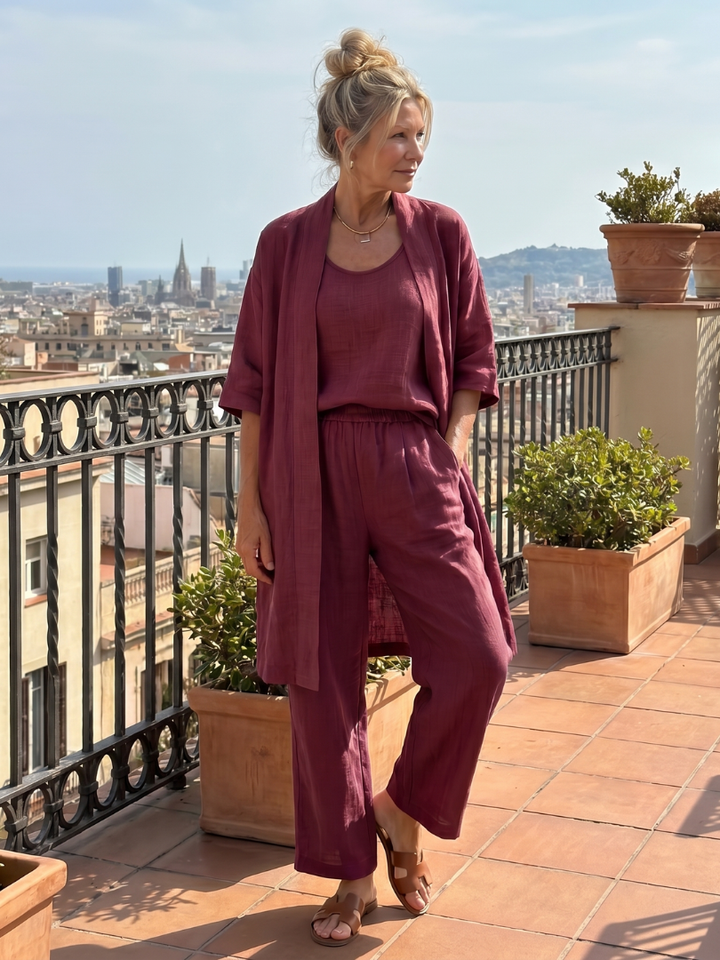 Chic women's three-piece apparel set, combining a relaxed top, wide leg pants & outer layer.