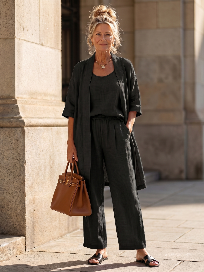 Comfortable women's co-ord set featuring a relaxed top, wide leg pants, & open front cardigan.