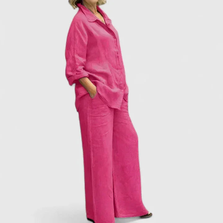 Effortlessly chic women's spring/summer outfit: relaxed button-down shirt and wide leg pants set.