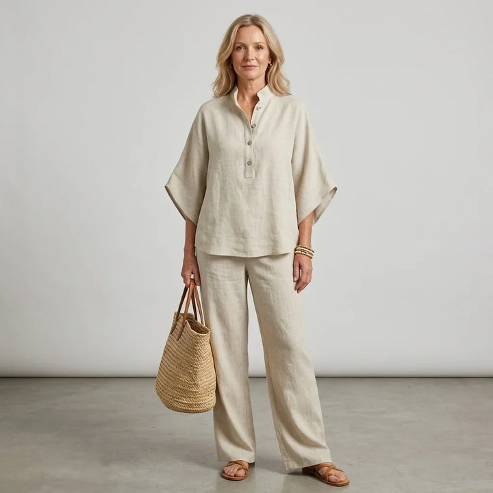 Full length view of the women's relaxed two-piece outfit: Henley top and wide-leg trousers.