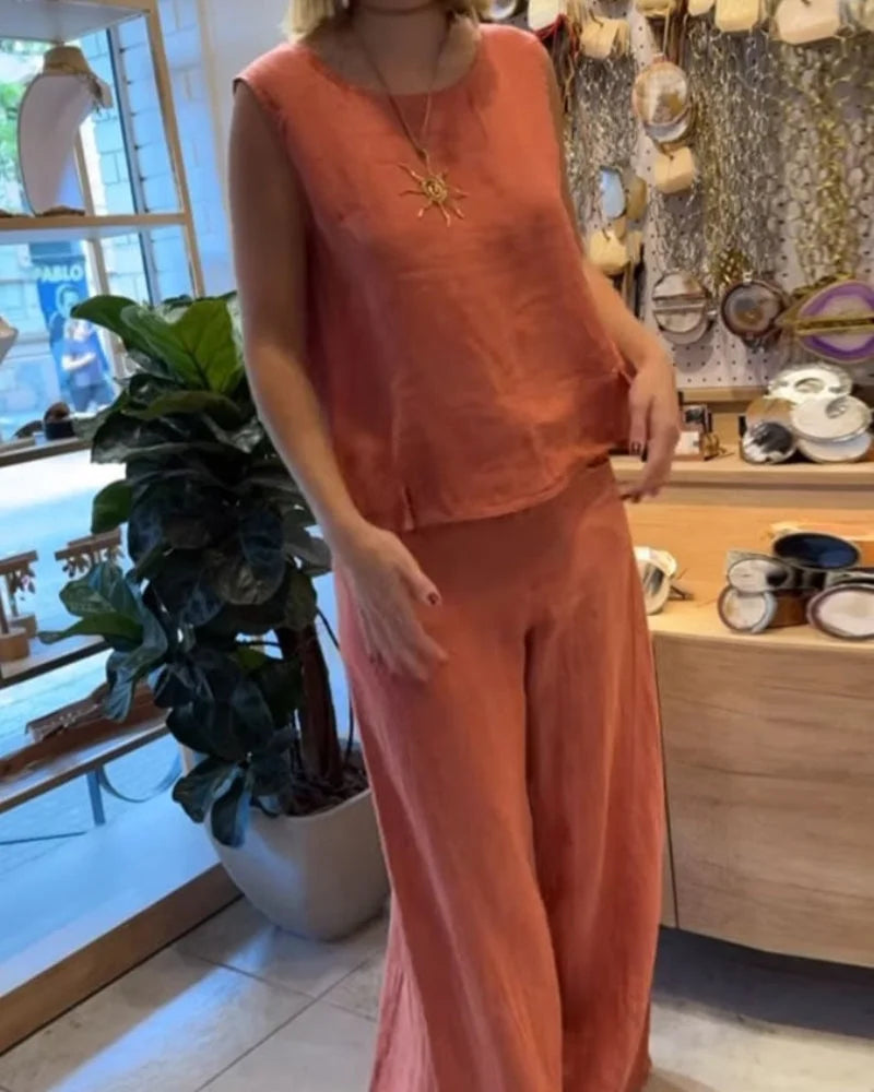 Chic women's coordinated set: sleeveless top & wide-leg pants, perfect for resort or vacation style.