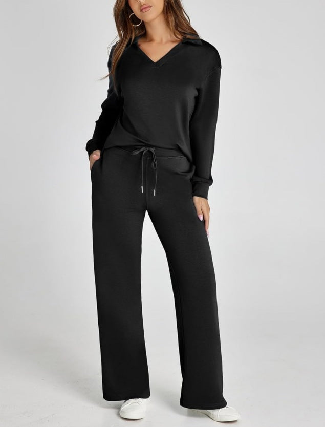 Women's relaxed V-neck top & wide leg pants lounge set in soft fabric. Comfortable two-piece loungewear for home.