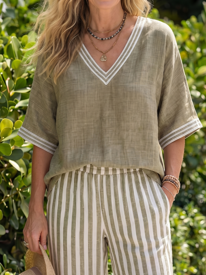Trendy women's two-piece: relaxed V-neck tunic & striped wide-leg pants for daily wear.